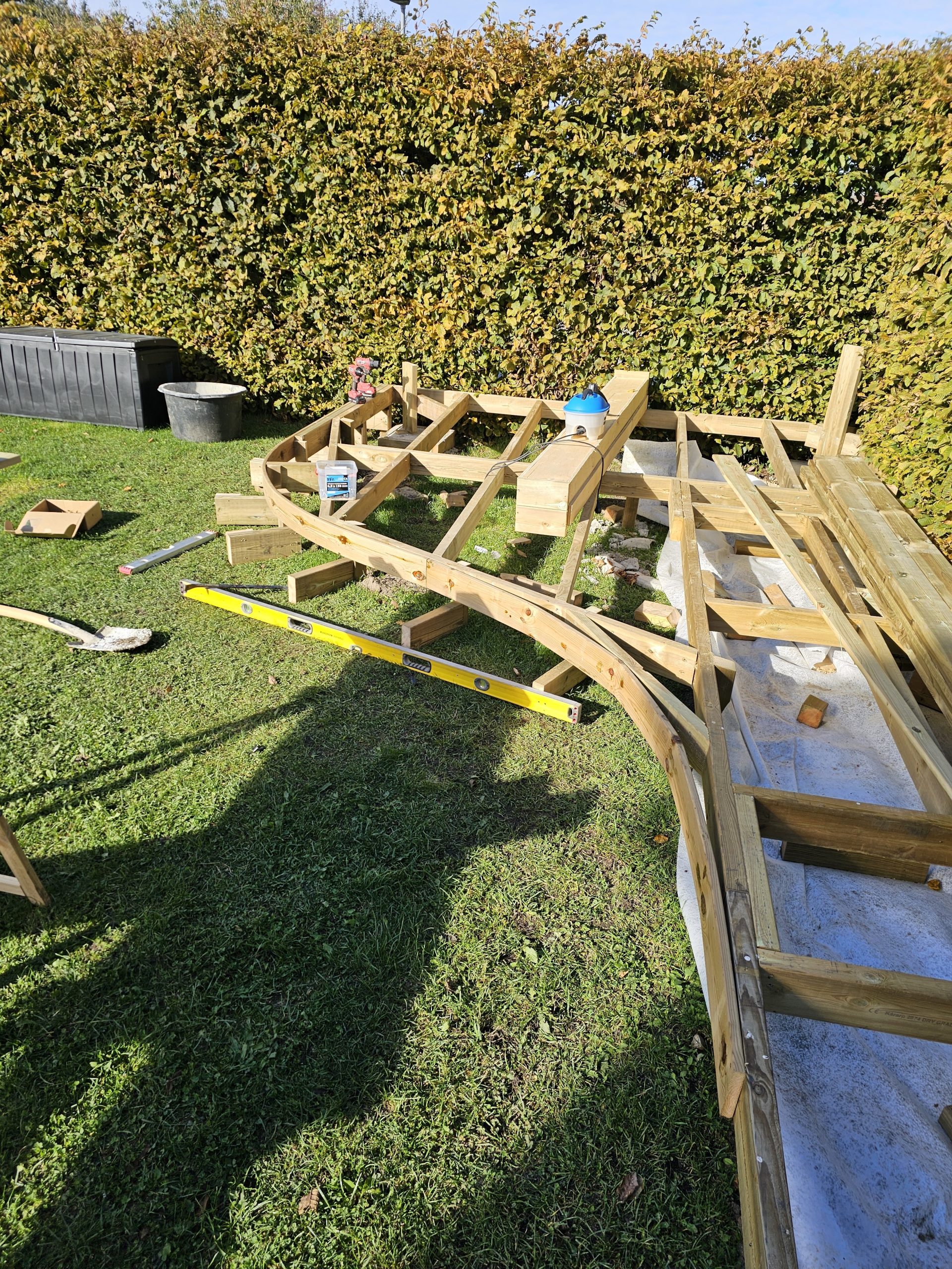 Custom pine decking around existing garden in Malmö